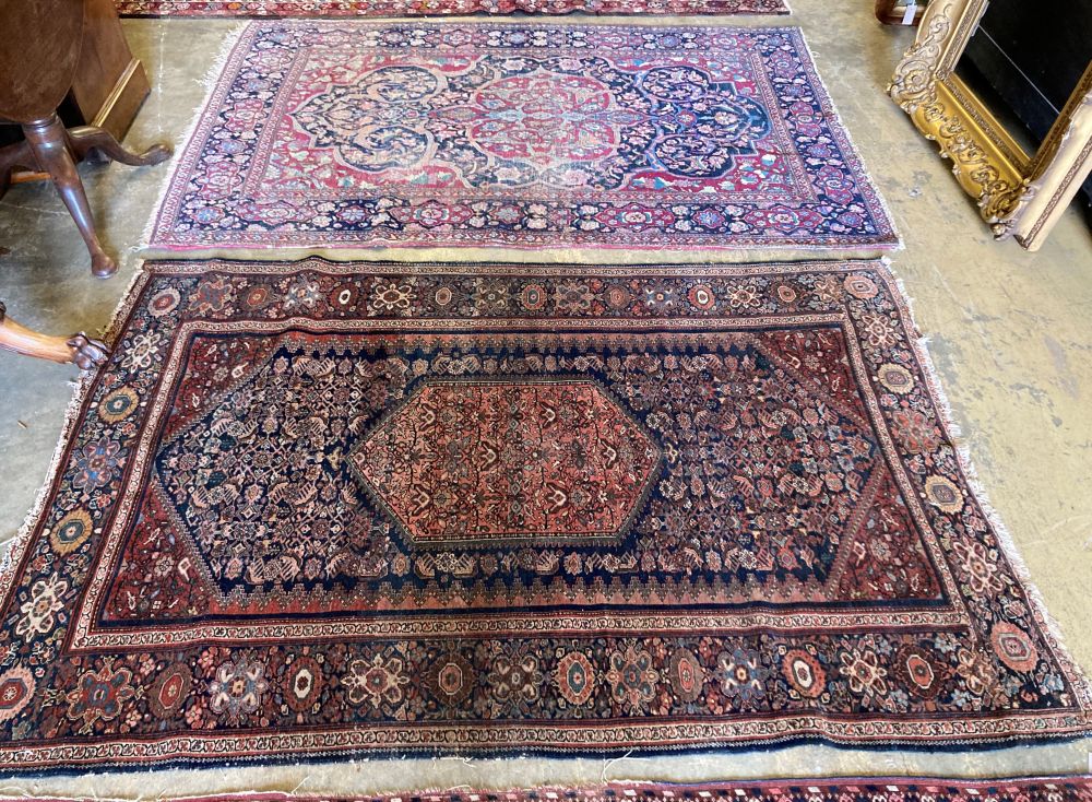 A Tabriz red and blue ground rug with pole medallion, 205 x 138 cm (worn) and a Fereghan rug